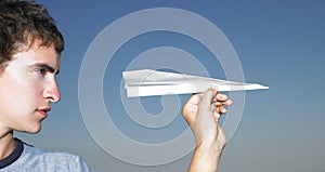 Young Man with Paper Airplane