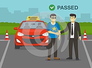 Young man passes his practical driving test. Examiner congratulates and shaking driver`s hand.
