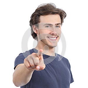 Young man with a perfect white smile pointing at camera photo
