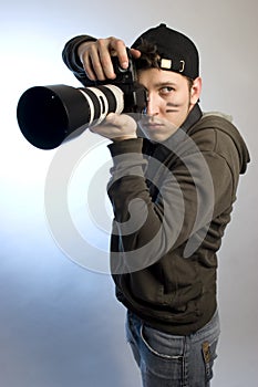 Young man with a photo camera