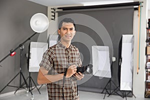 Young man photographer smiling