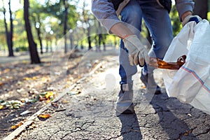 Young man picking up trash