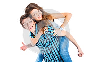 Young man piggybacking his girlfriend