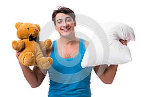 The young man with pillow isolated on white background