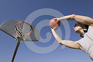 Young man playing basketball