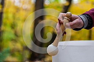 Young Man playing crystal bowls outdoors in the forest in the fall 2/12