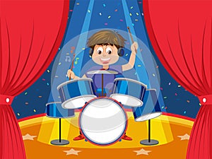 Young man playing drum on stage