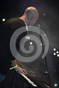 Young man playing electronic keyboard.