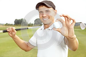 Young man playing a game of golf