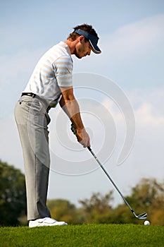 Young man playing golf