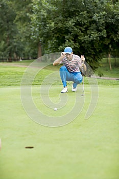 Young man playing golf
