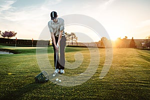Young man playing golf