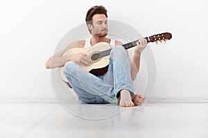 Young man playing guitar