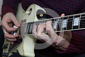 A young man playing guitar