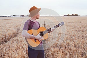 Young man playing guitar, romantic music love song