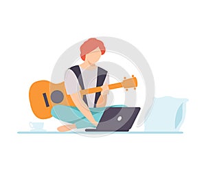 Young Man Playing Guitar, Guy Learning Guitar Through Internet Course Using Laptop Comuter, Online Education, Hobby