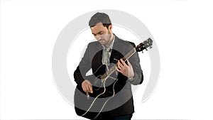 Young man playing guitar on white background isolated