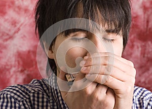 Young man playing harmonica