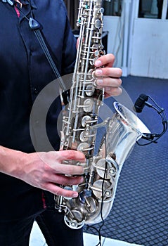 Young man playing the saxophone at the wedding