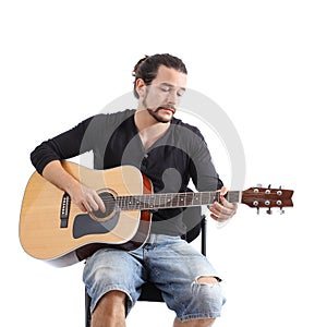 Young man playing a spanish guitar