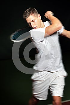 Young man playing tennis