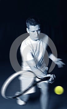 Young man playing tennis