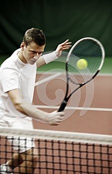 Young man playing tennis