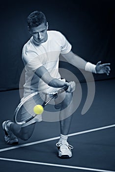 Young man playing tennis