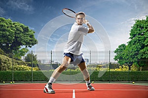 Young man is playing tennis