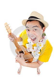 Young man playing ukulele