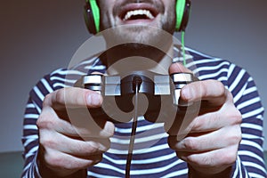 Young man playing video games at home