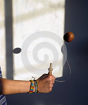 young man playing wooden bearing photo