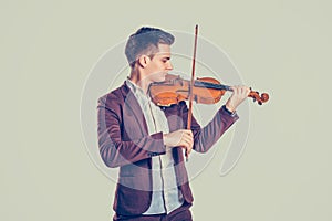 Young man playing on wooden violin