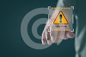 Young man pointing at exclamation mark icon, warning label concept, safety warning sign, maintenance error message, warning system