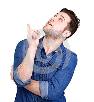 Young man pointing finger up