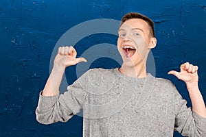 Young man pointing itself
