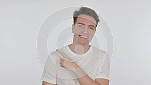 Young Man Pointing on Side on White Background