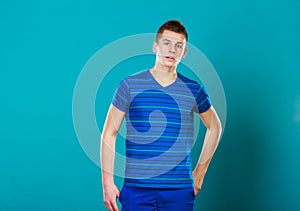Young man portrait on blue