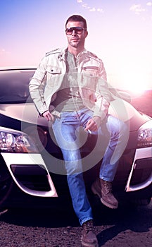 Young man portrait and car