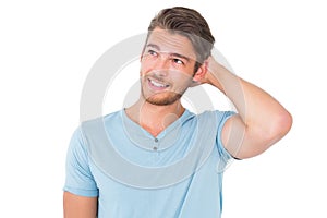 Young man posing with hands on head