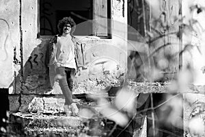 Young Man Posing at Ruins Ruined House