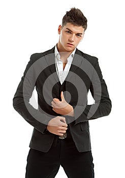 Young man posing in studio dressed in a suit
