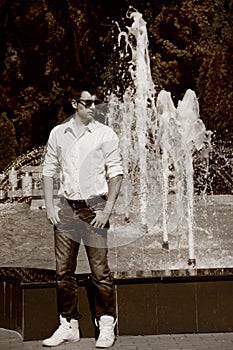 Young man posing in white shirt