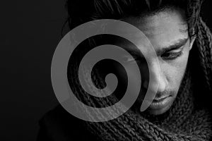 Young man posing with wool scarf