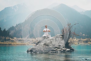 A young man practices yoga. Exercise Agni Stambhasana