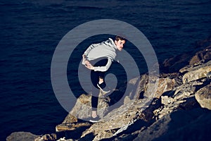 Young man practices yoga to relax from the stress of the city and exercise