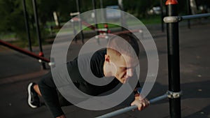 Young Man Practicing Outdoor Push-Ups at a Fitness Park