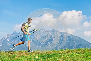 Young man practicing physical activity mountain and running with