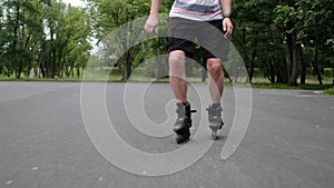 Young man practicing roller scating in park