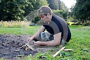 Young man practicing survival training